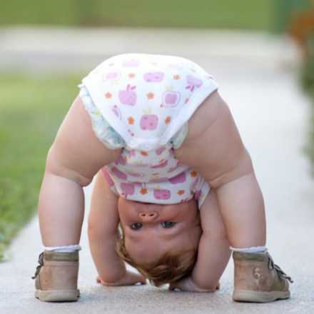 Baby playing upside down