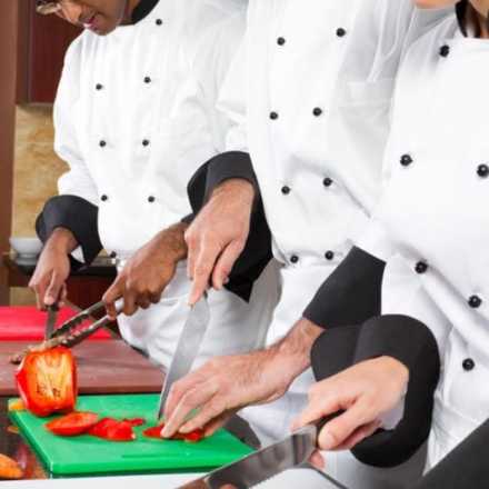 Chefs preparing food in a kitchen