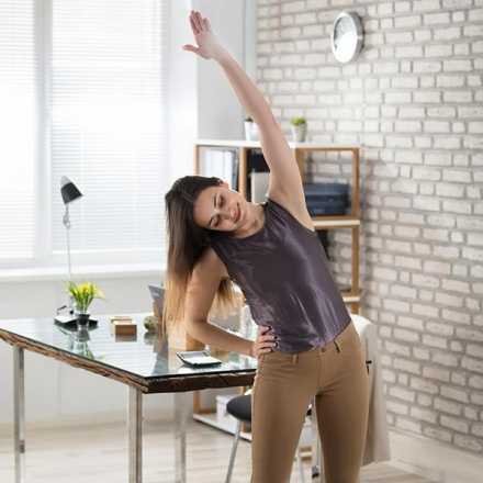 Woman stretching in her house