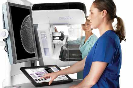 Patient receiving Genius™ 3D Mammography™ exam