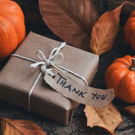 pumpkins, leaves and gift with thank you written on it