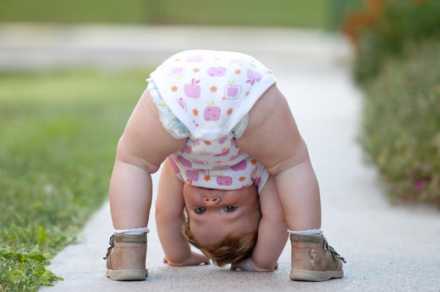 Baby playing upside down