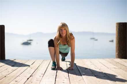 Nancy Brest doing a lunge on a dock