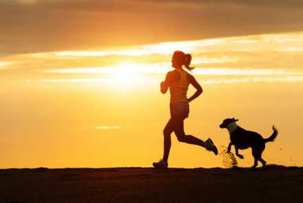 Woman running with dog