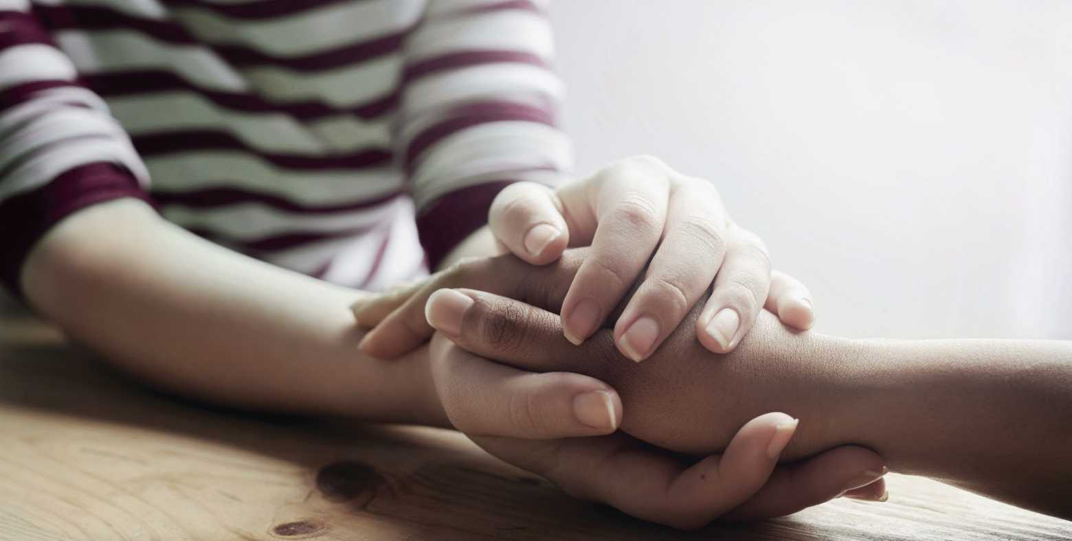 person grasping another person's hand