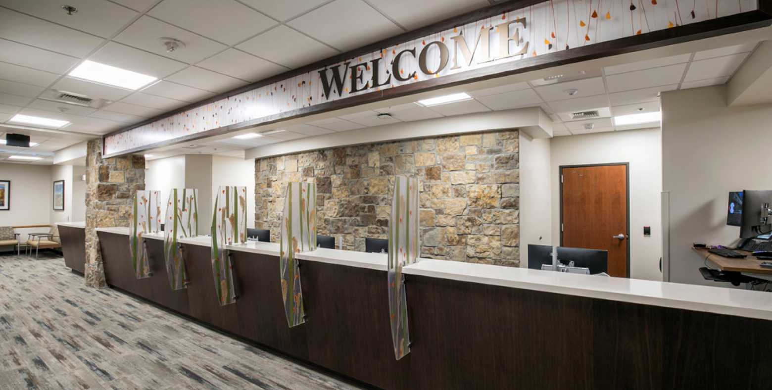 Front desk with welcome sign for multi specialty clinics on 2nd floor of Tahoe Forest Cancer Center