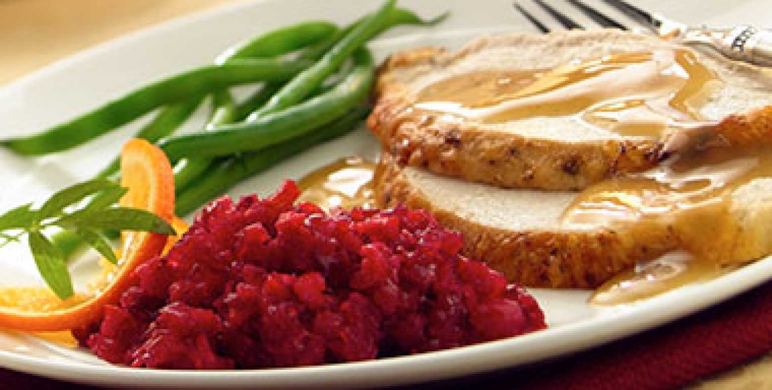 plate with turkey, gravy, green beens, cranberry relish