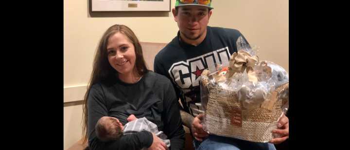 TFH First baby of 2019 with parents and gift basket