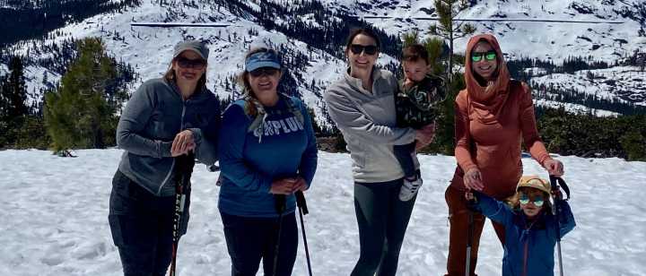 Nurses of TFHS winter hiking with backdrop of snowy mountain