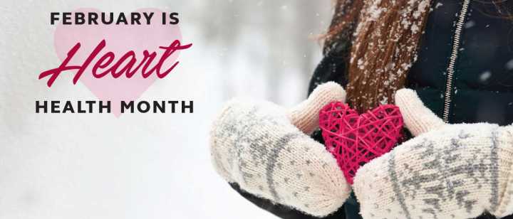 February is Hearth Health Month: woman in the snow holding a heart