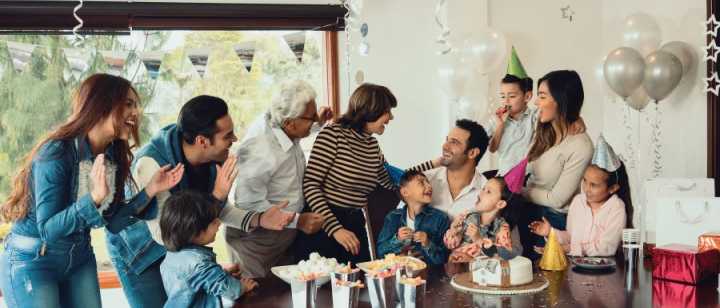hispanic family celebrating birthday