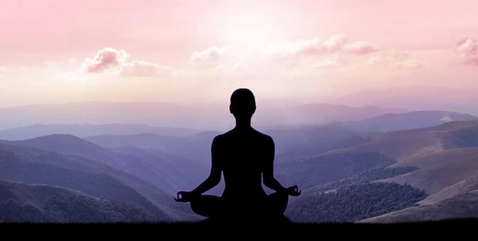 AdobeStock_199028723.small__0 meditating on a mountain top