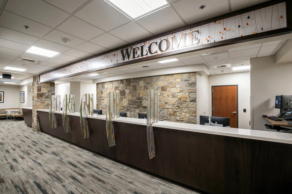 Cancer-Center-Offices-22-web-resolution Front desk with welcome sign for multi specialty clinics on 2nd floor of Tahoe Forest Cancer Center