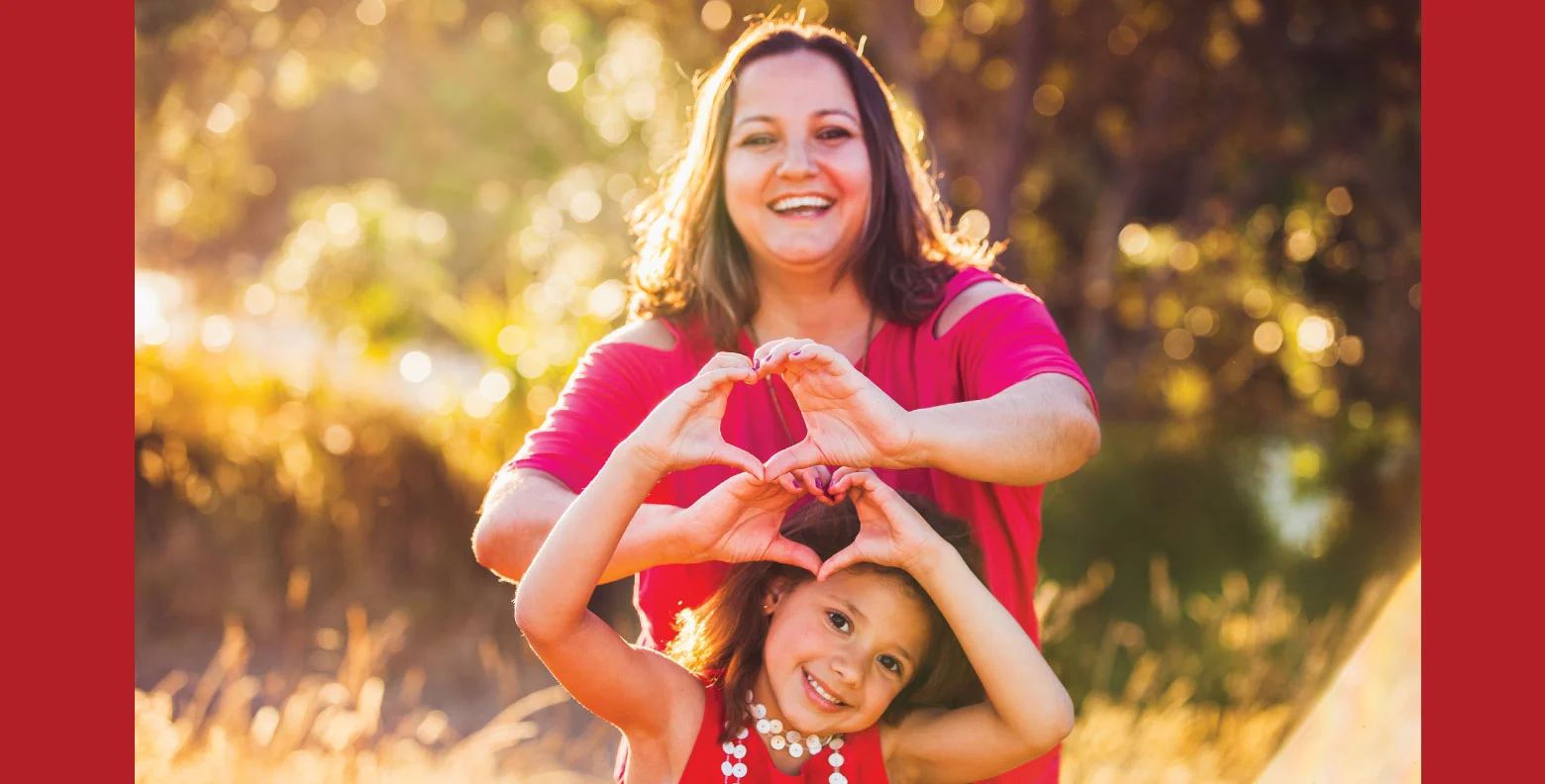 Pritikin-website-image mother and daughter forming heart with hands