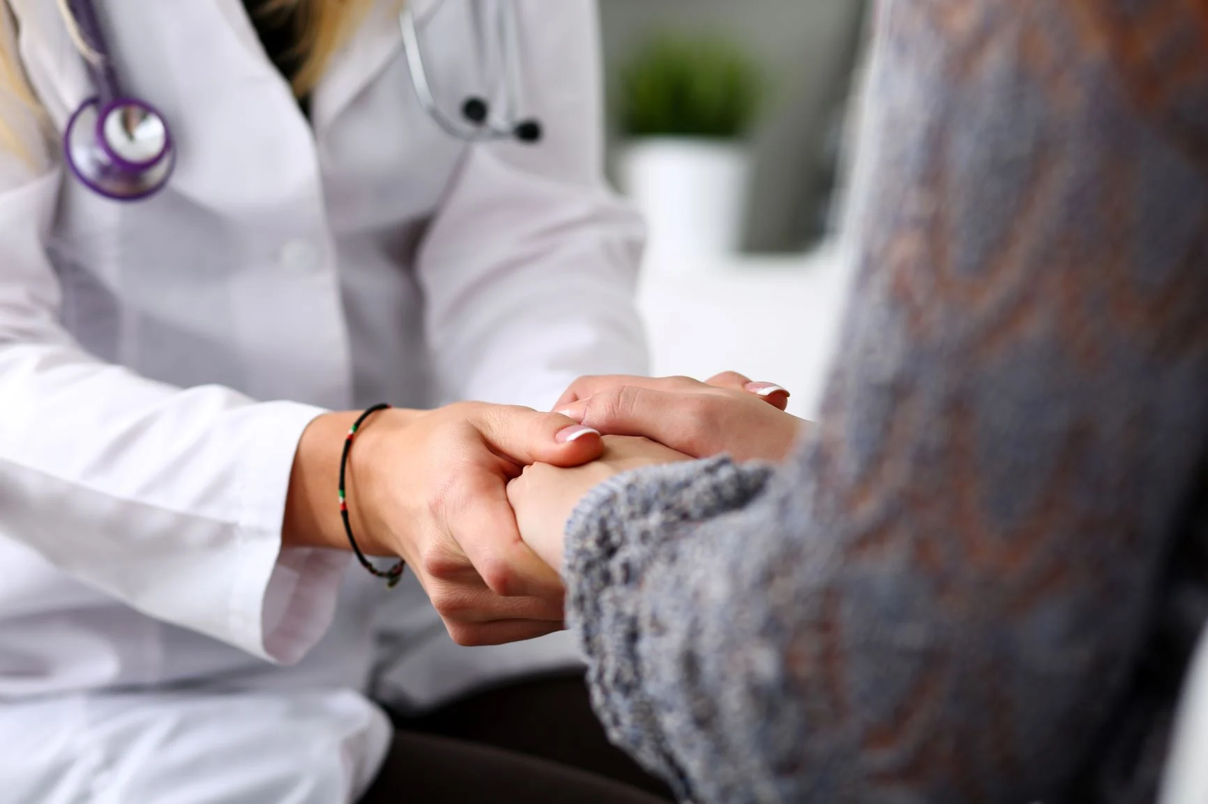 caring_hands A doctor holds a patient's hands