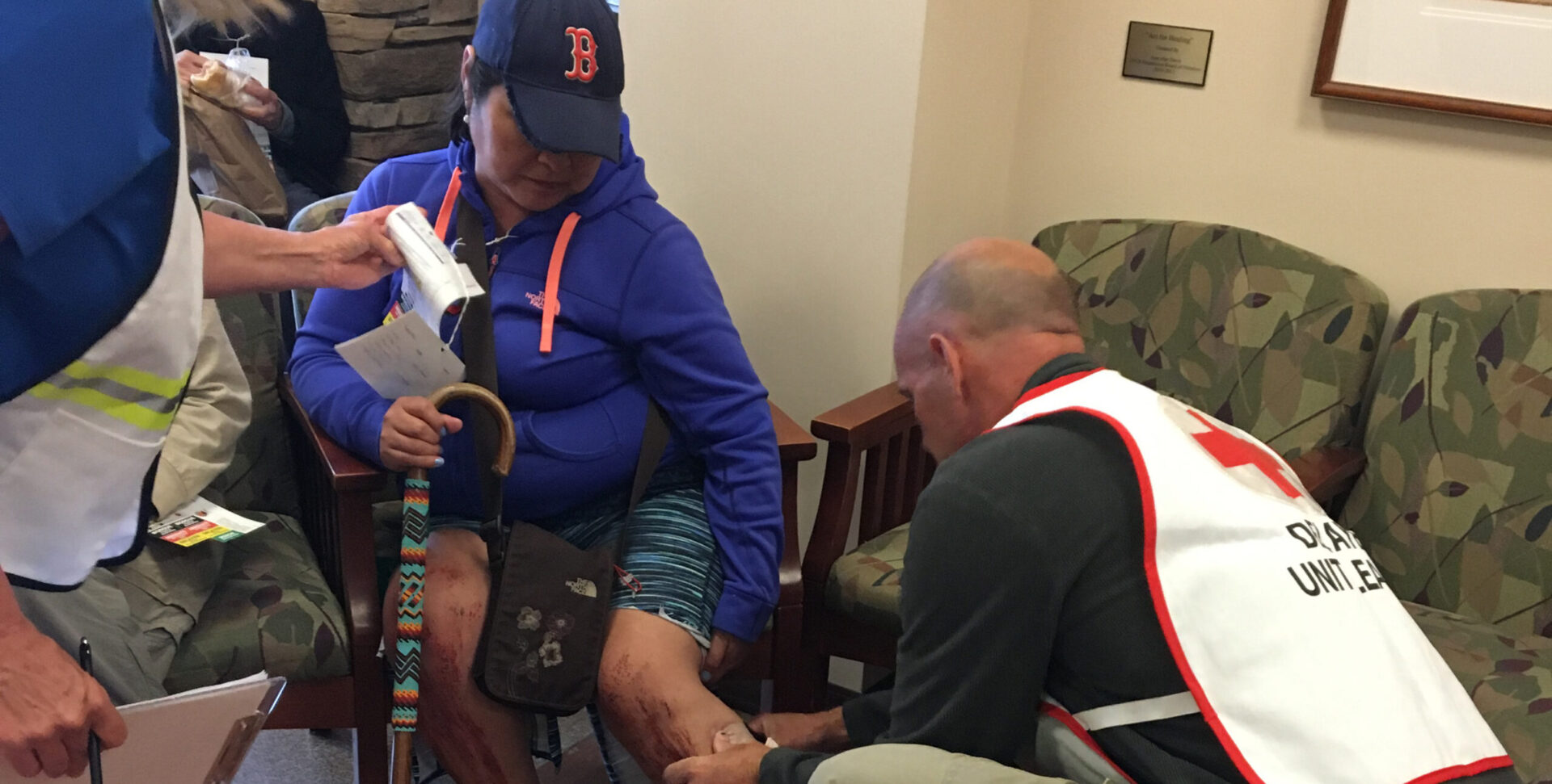 Incline Village Community Hospital nurses Janet Glenny and Mike Freed assess a Community Emergency Response Team volunteer with a simulated severe leg injury during the airport disaster exercise