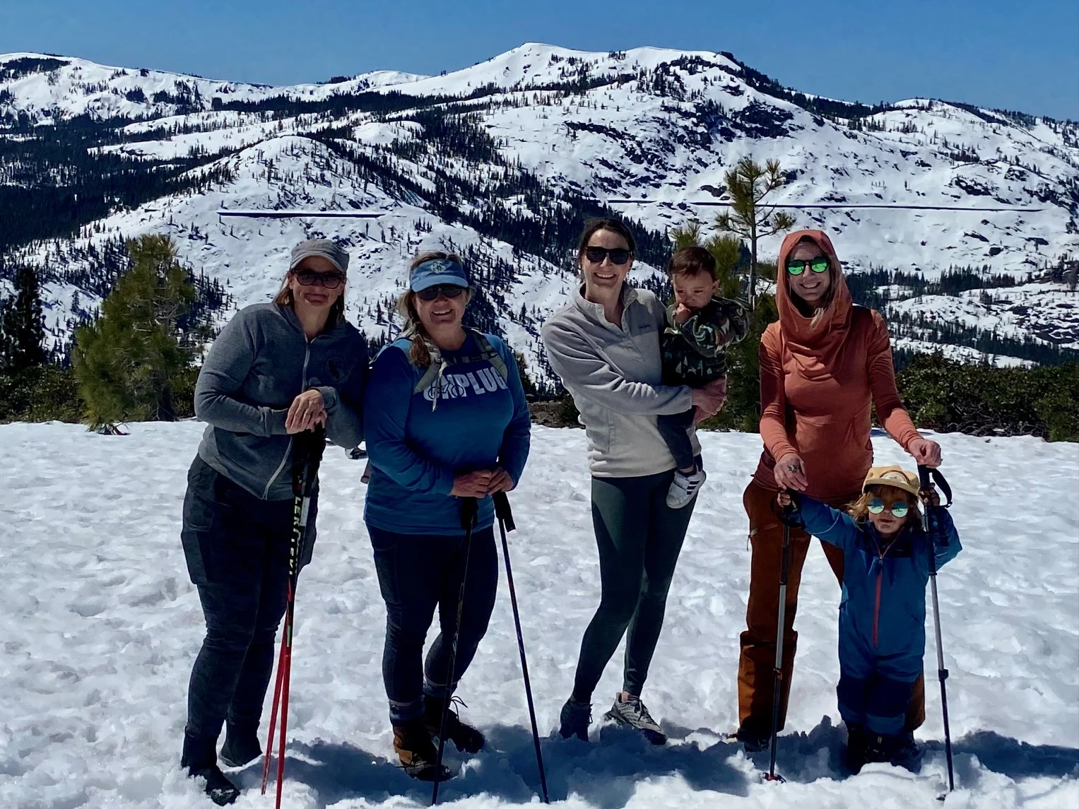 Nurses of TFHS winter hiking with backdrop of snowy mountain