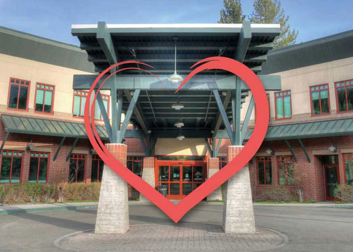hospital entrance with a heart superimposed