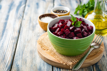 Beetroot salad with parsley in bowl on rustic wooden table beetroot salad