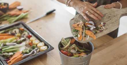scraps food scraps into compost bin