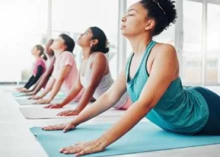 women practicing yoga