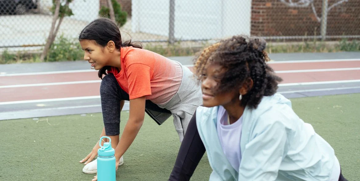 TFHS-news Girls stretching at track practice