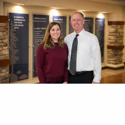 donorwall Karli epstein in front of the IVCH donor wall