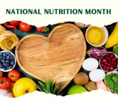 nutritionmonth-400×333 national nutrition month heart shaped wooden bowl surrounded by healthy food