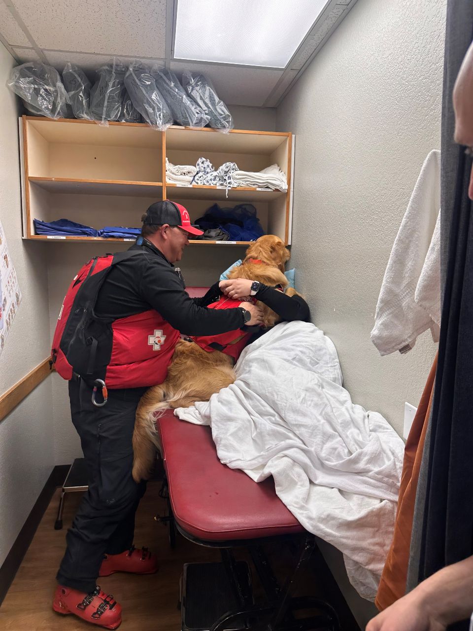 Bracket pic patient hugging avalanche rescue dog