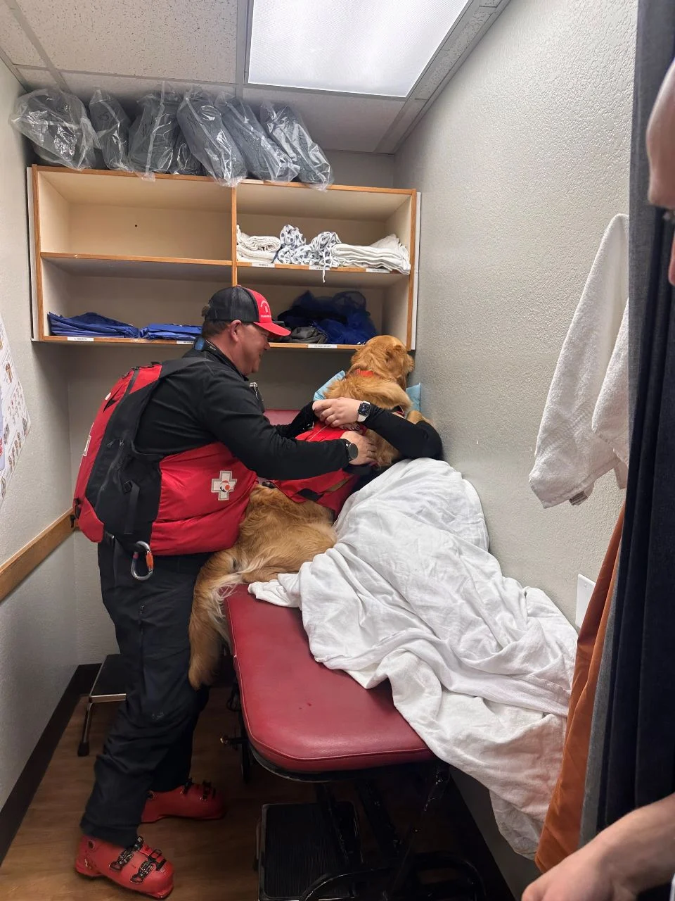 Bracket pic patient hugging avalanche rescue dog