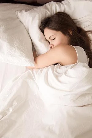 sleep woman sleeping in white bedding