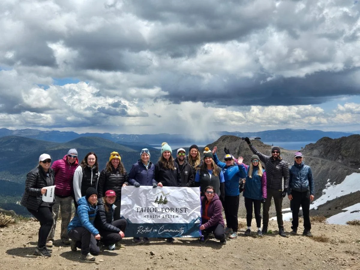 brokenarrow group of broken arrow sky racers holding Tahoe Forest banner
