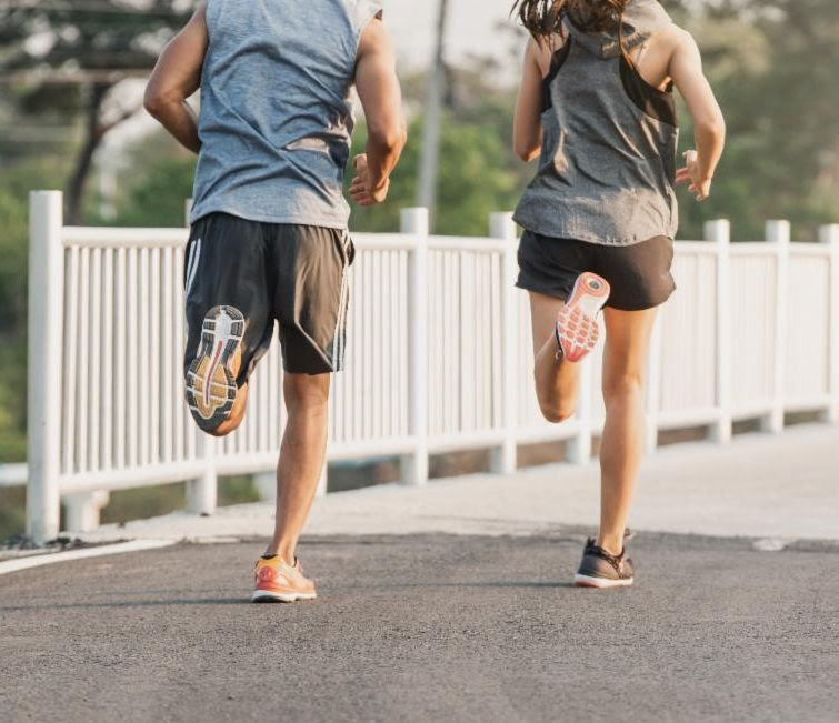 couple running two runners