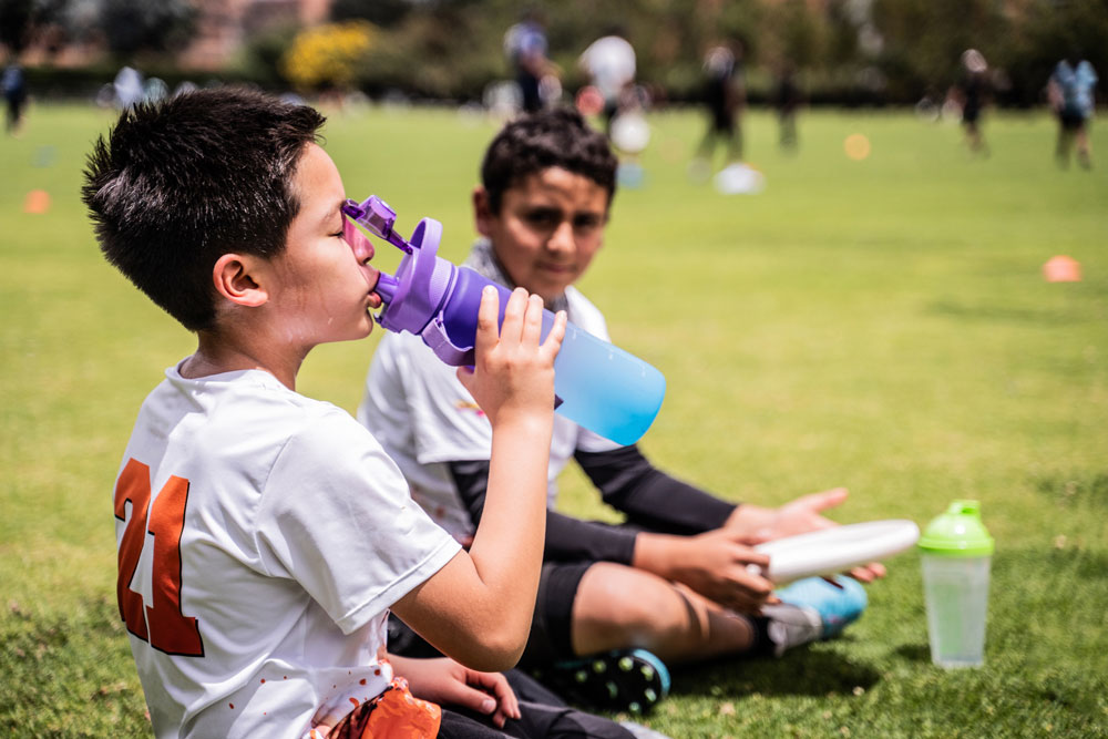 heatstroke boys at sports field drinking water