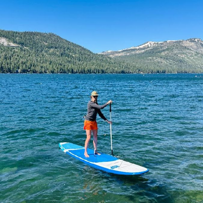 Person stand up paddling on a lake