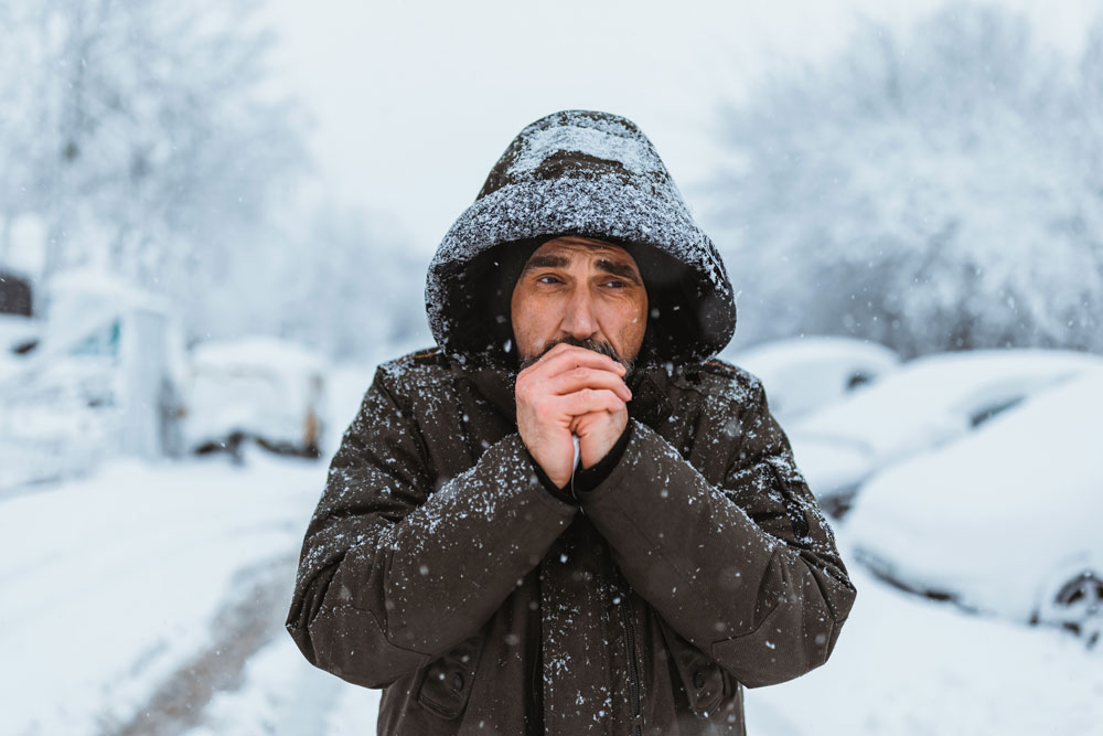 Man in snow in heavy jacket