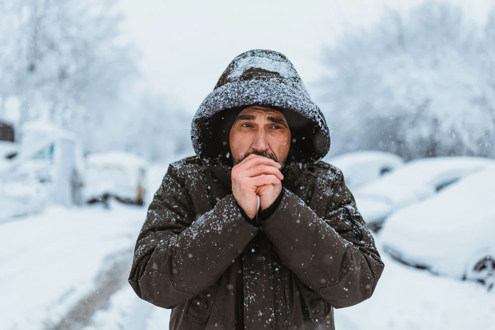 man-in-snow-cold Man in snow in heavy jacket