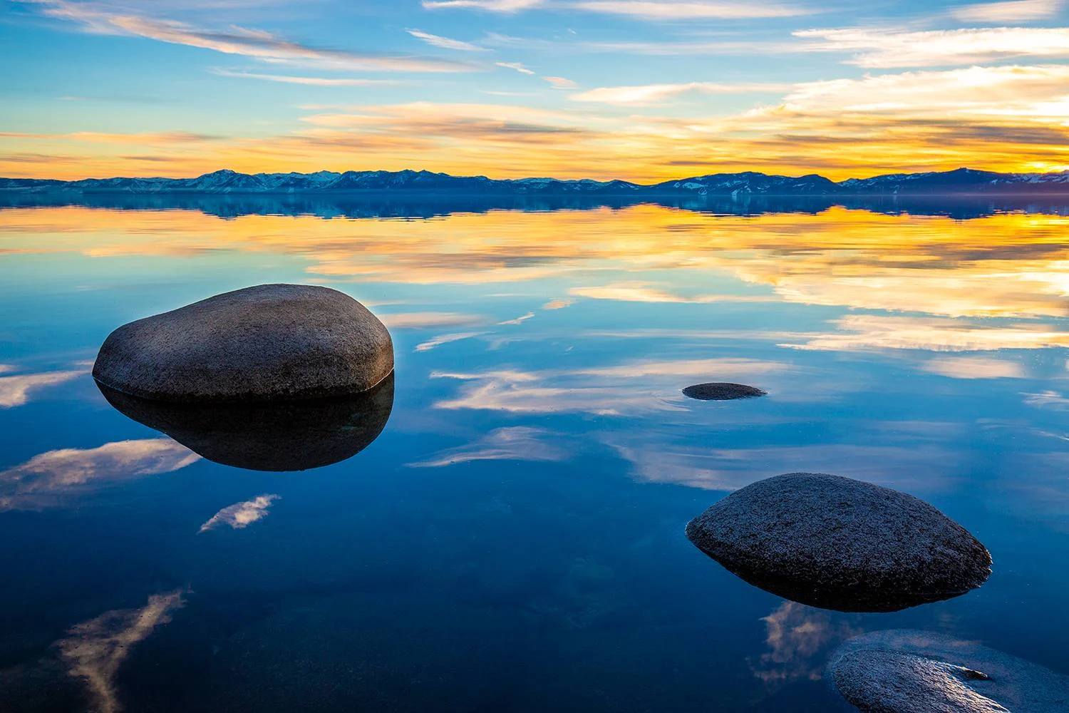 tahoereflection yellow sunset reflected in lake tahoe water