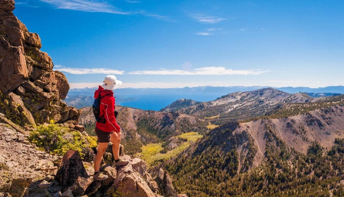 hiker looking off into a vast expanse