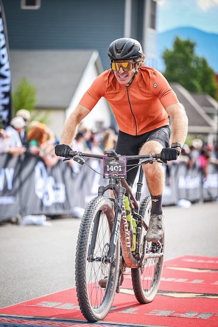 Dr. Joshua Pfent crossing finish line of Leadville 100 MTB Race
