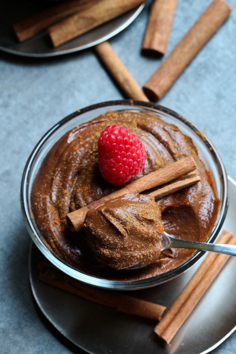 chocolatepudding chocolate pudding with cinnamon sticks and raspberry