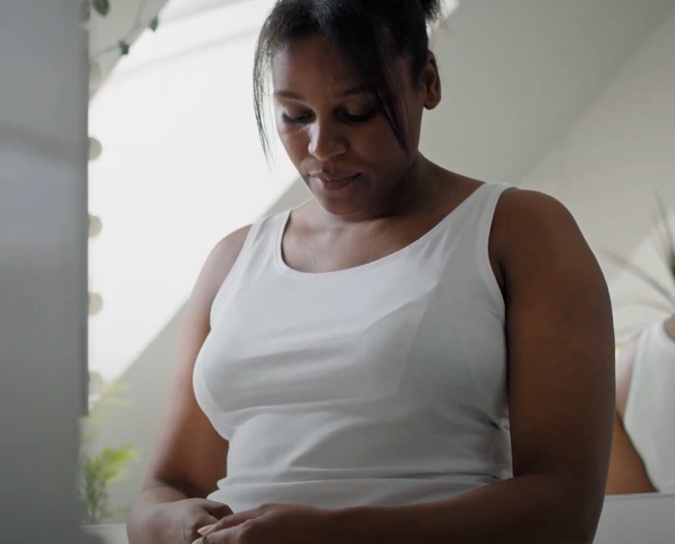 woman measures her waistline