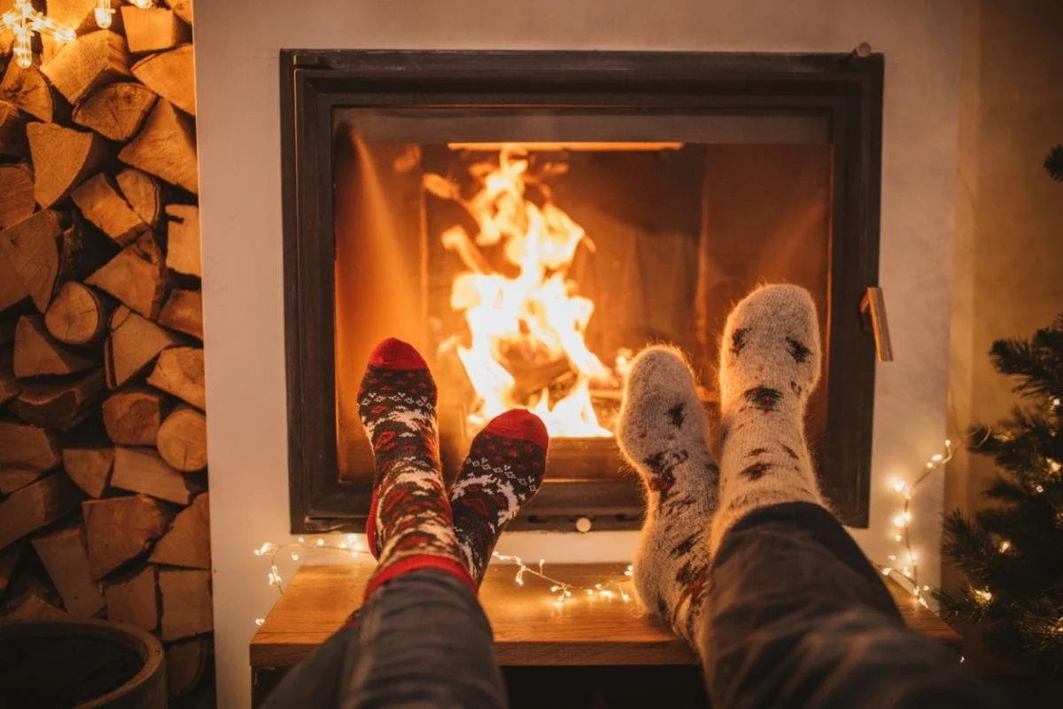 cozyfire cozy socked feet in front of fireplace