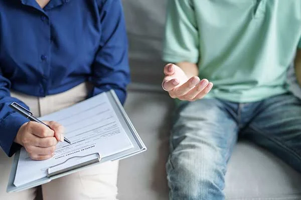 parent and teen filling out forms