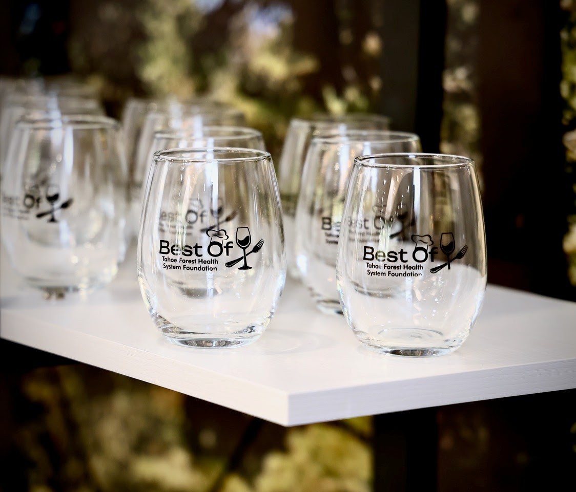 Stemless wine glasses with the Best Of logo on them