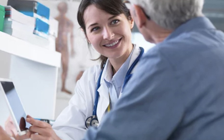 A physician meeting with a patient