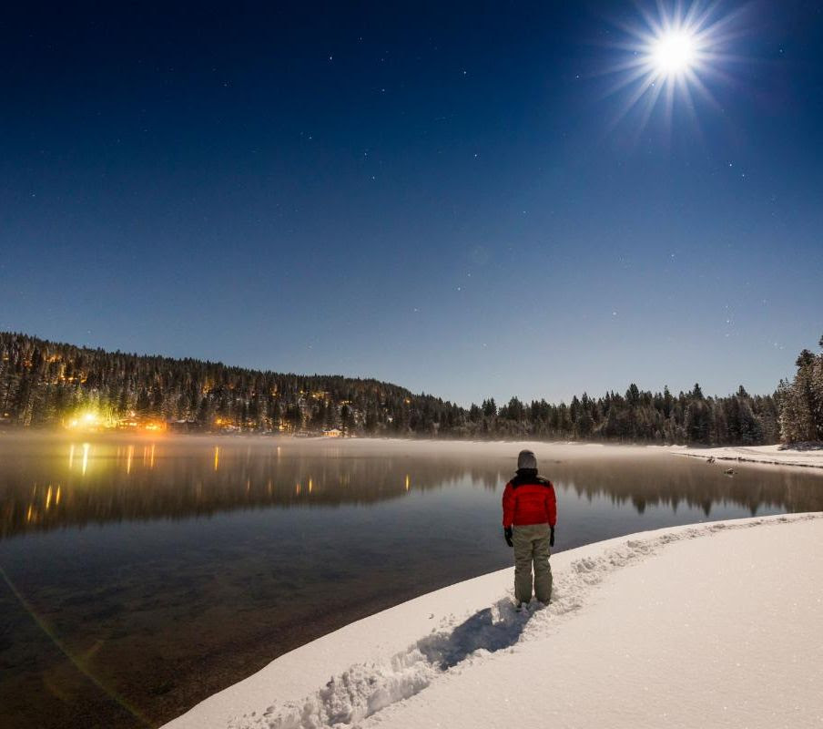 full moon over donner lake at night