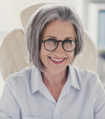 patient older woman with glasses