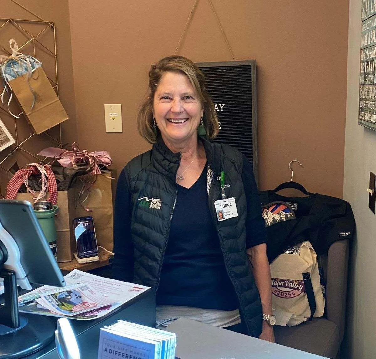 volunteer3 volunteer at thrift store behind desk
