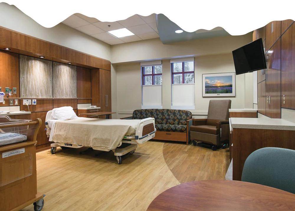 women and newborn care room